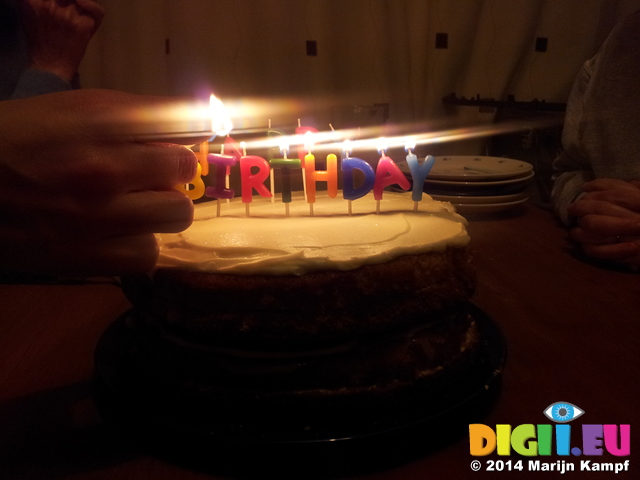 20140116_202002 Lighting Happy Birthday candles on cake